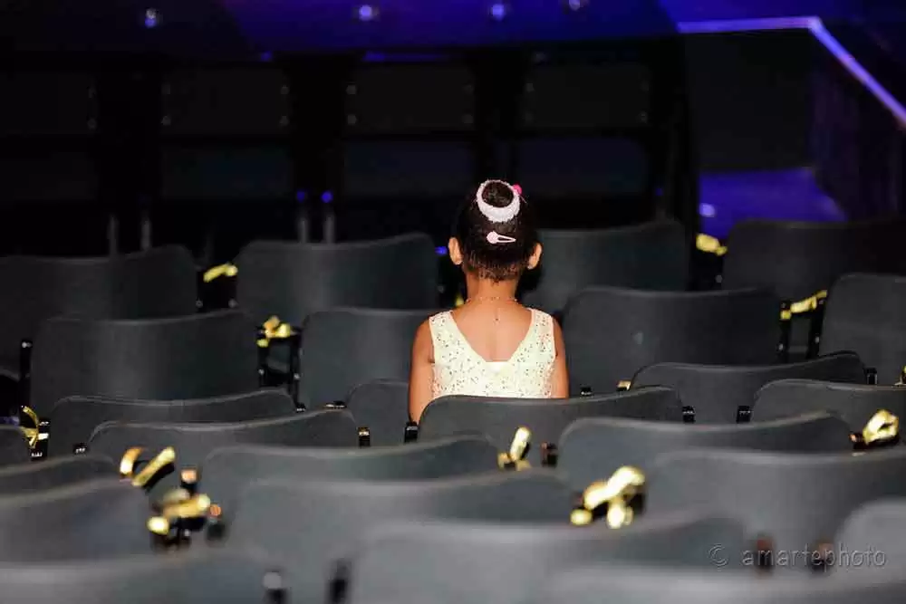 Kids and Teens with Newly Diagnosed Celiac Disease Can Face Extra Challenges - A child sits alone in a theater. Image: CC BY 2.0--4CamRes