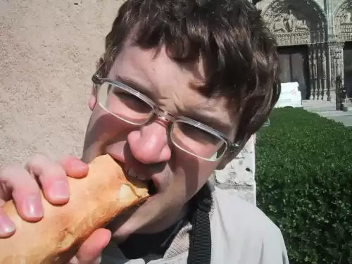 New Technology Promises Gluten-free Breads That "Taste Like Real Thing" - Grant eating a baguette by nertzy is licensed under CC BY-SA 2.0.