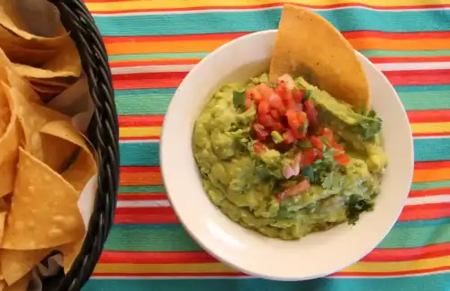 Authentic Mexican Gluten-Free Guacamole - Guacamole and chips by sarahstierch is licensed under CC BY 2.0.