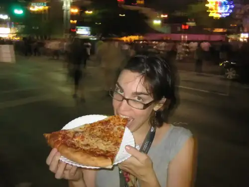 CRISPR/Cas9: A Game-Changer for Gluten-Free Wheat - Amy eating pizza at SXSW by ghewgill is licensed under CC BY 2.0.