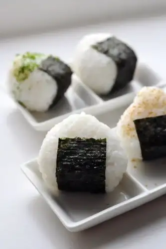 Gluten-Free Onigiri: A Portable Taste of Japan - Japanese rice balls (onigiri) by tednmiki is licensed under CC BY-SA 3.0.